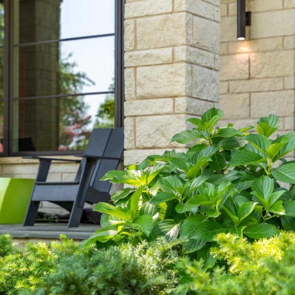 Hydrangeas on a peaceful southern porch on a featured Southern Botanical landscaping maintenance. property