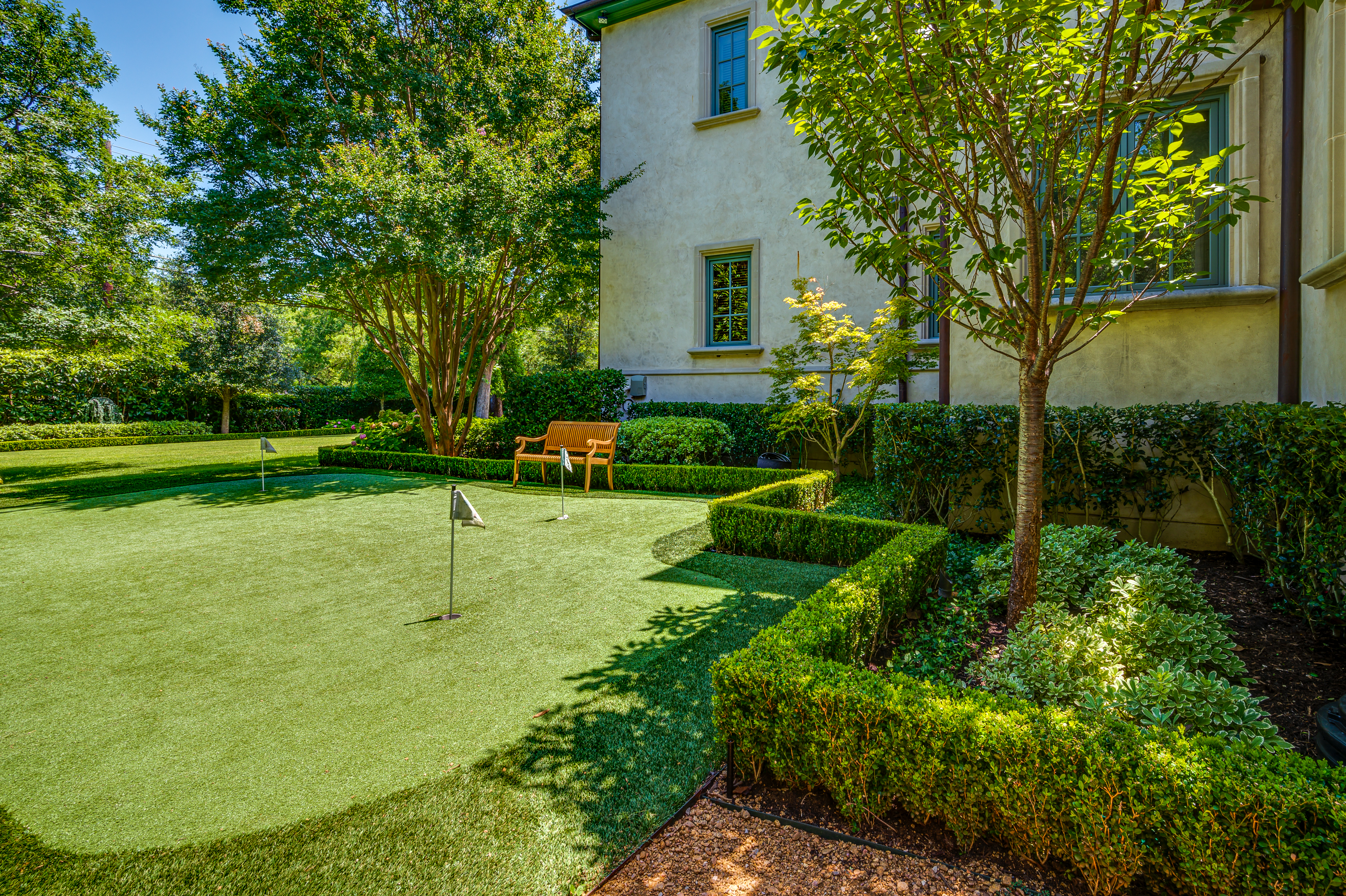 a lawn with a bench in the middle of it | Southern Botanical