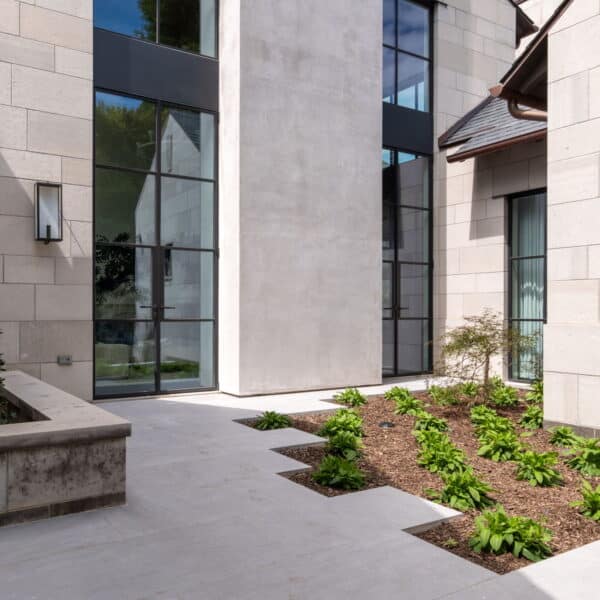 Hardscape and landscape elements compliment one another in this modern landscape planted and maintained by Southern Botanical