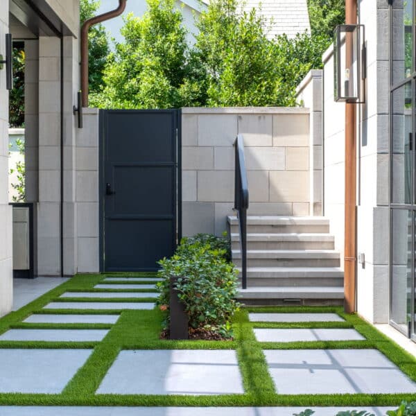 Hardscape and landscape elements compliment one another in this modern landscape planted and maintained by Southern Botanical